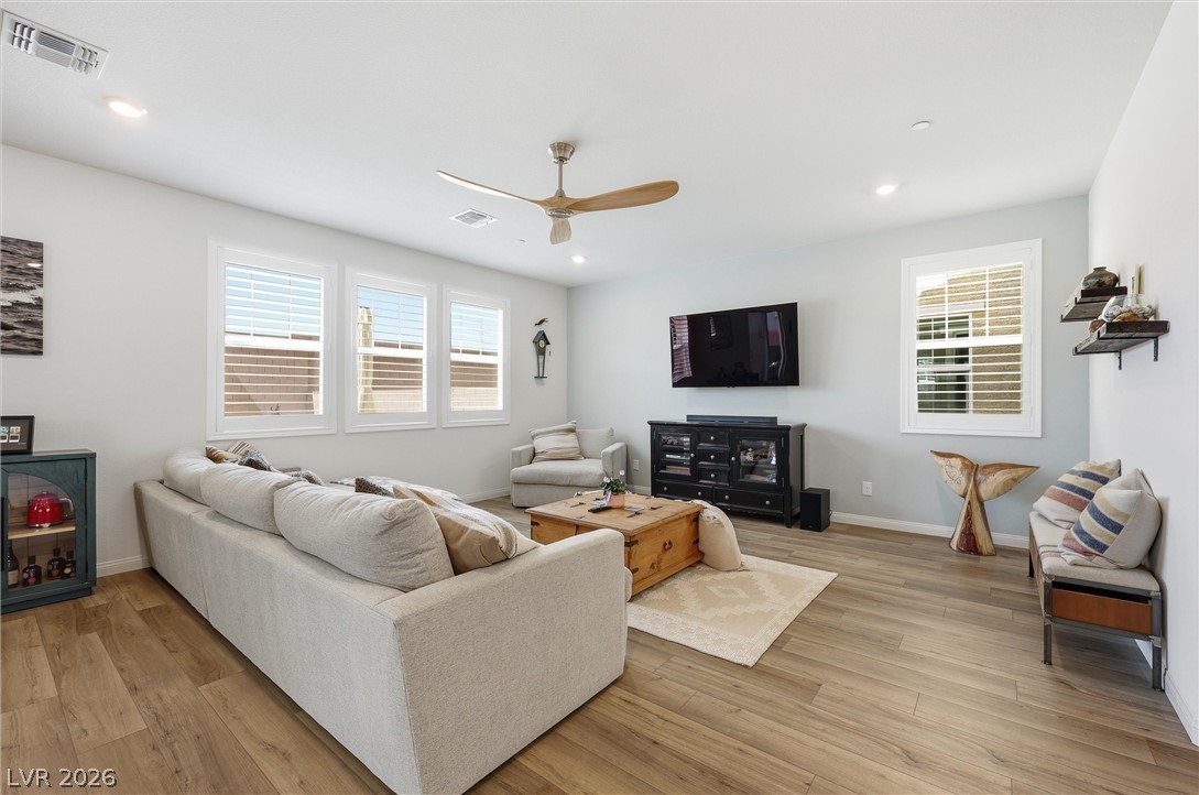 3705 Alla Rocca Avenue Henderson, NV 89044 - Photo 8 of 50 This living room features ample natural light and durable flooring, perfect for relaxation and everyday living.