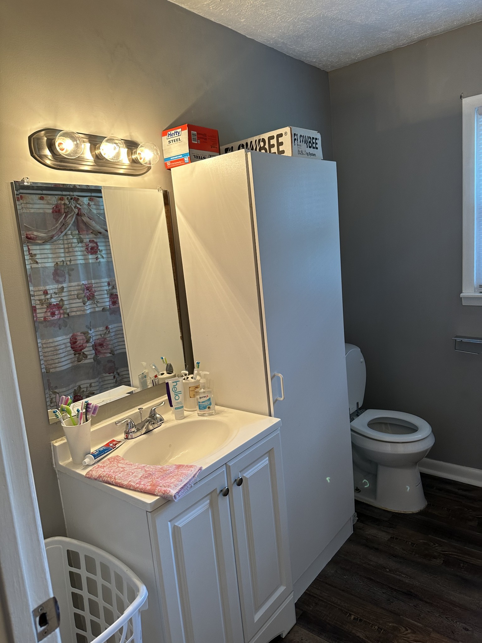 247 Petty Gap Road Woodbury, TN 37190 - Photo 13 of 23 a bathroom with a sink and a mirror