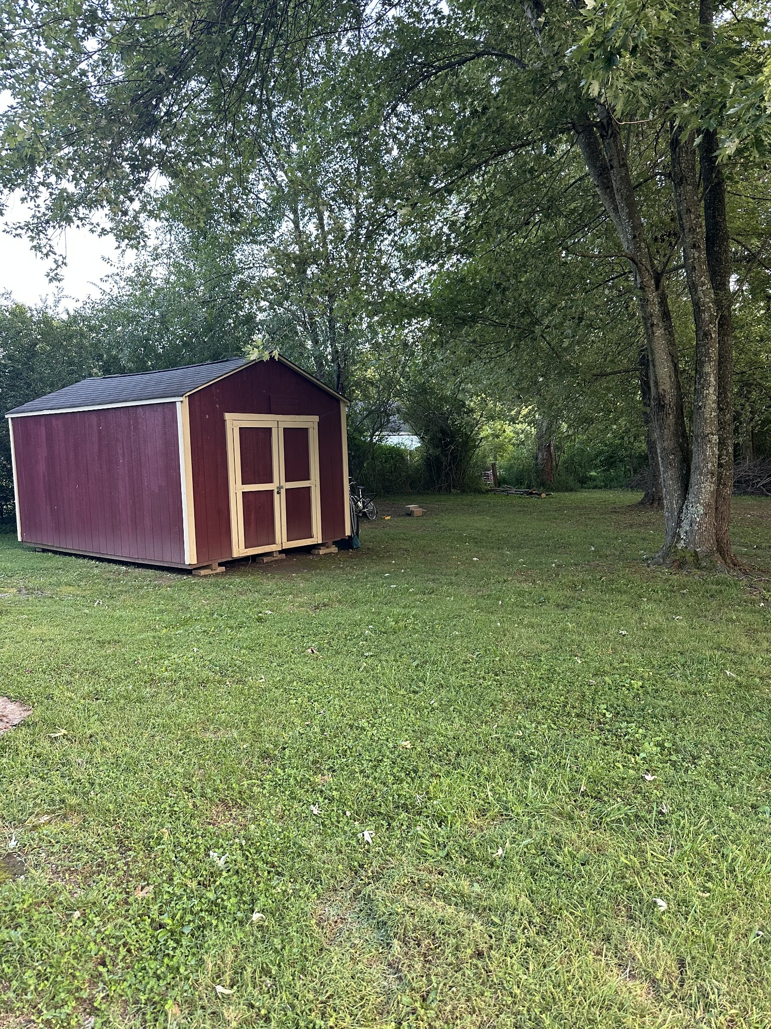 247 Petty Gap Road Woodbury, TN 37190 - Photo 22 of 23 a view of a backyard with a small cabin