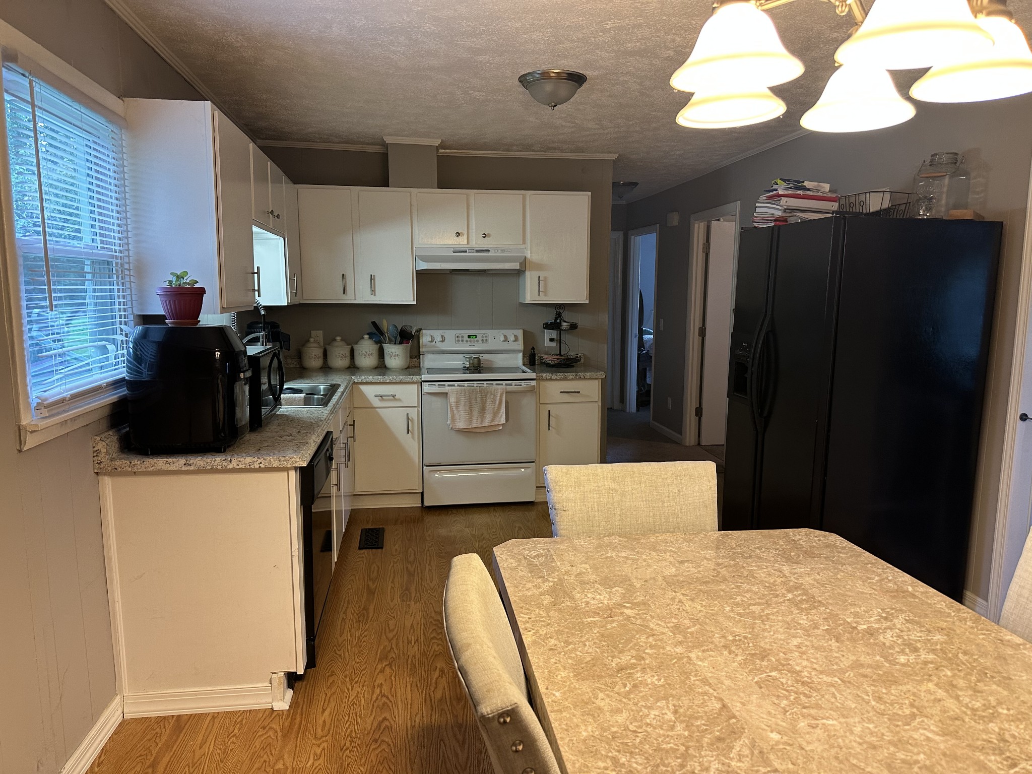 247 Petty Gap Road Woodbury, TN 37190 - Photo 7 of 23 a kitchen with a refrigerator and a stove top oven