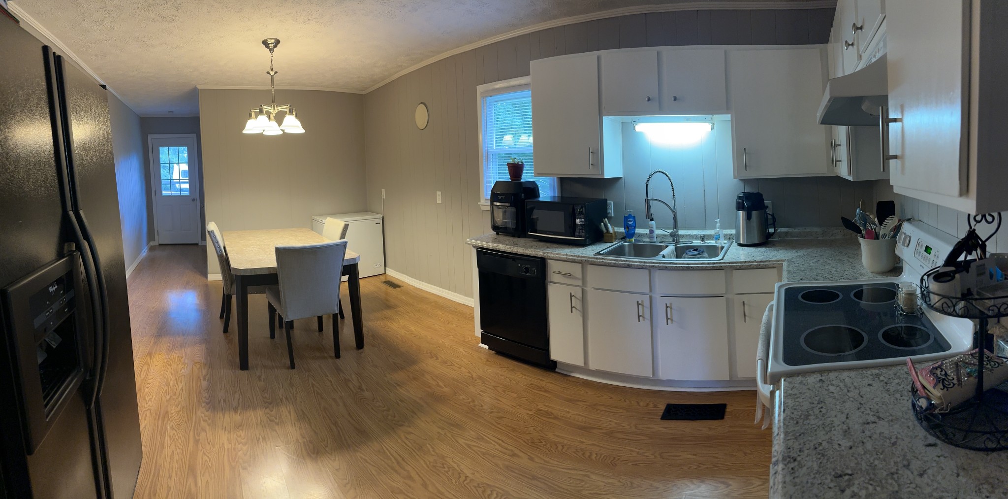 247 Petty Gap Road Woodbury, TN 37190 - Photo 8 of 23 a kitchen with stainless steel appliances granite countertop a stove a sink a refrigerator and chairs