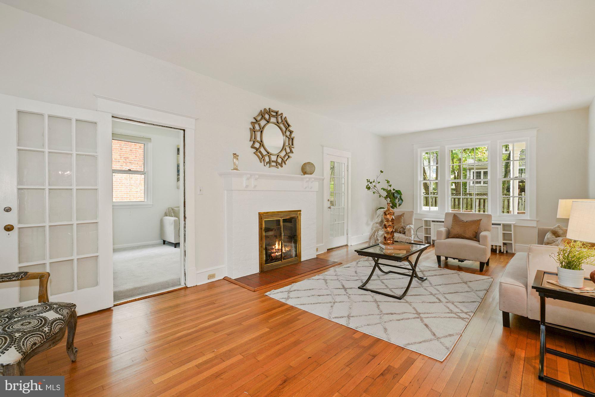 3738 Military Road Northwest Washington, DC 20015 - Photo 14 of 44 Enormous living features a wood burning fireplace.