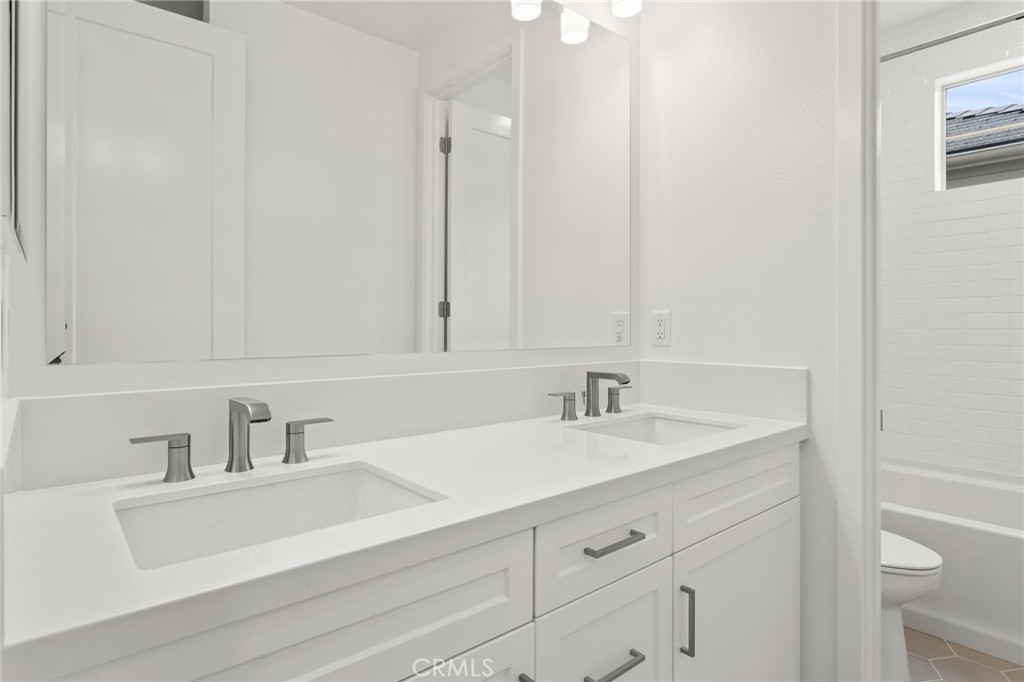 5208 Solace Drive Rancho Mission Viejo, CA 92694 - Photo 15 of 27 a bathroom with a sink and a vanity