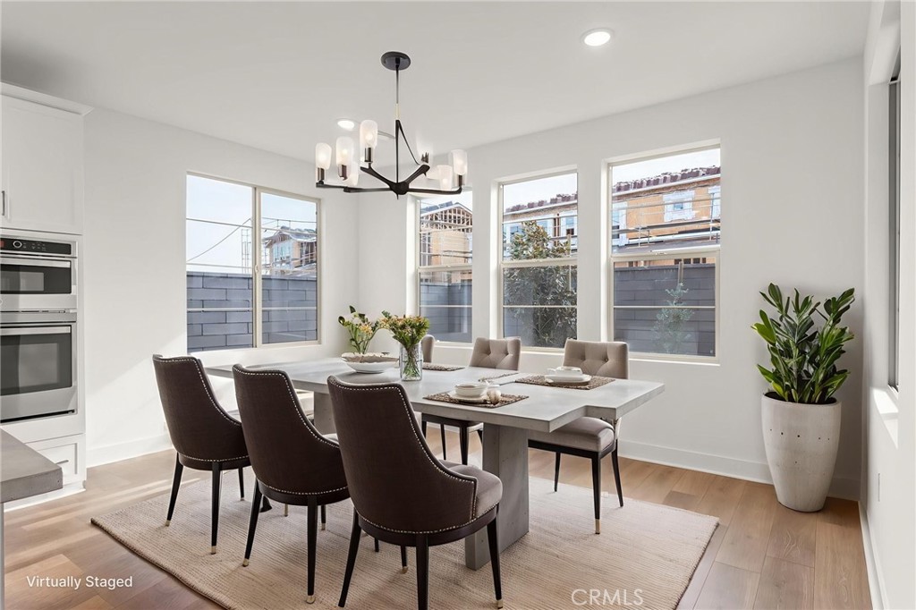 5208 Solace Drive Rancho Mission Viejo, CA 92694 - Photo 23 of 27 a view of a dining room with furniture window and outside view