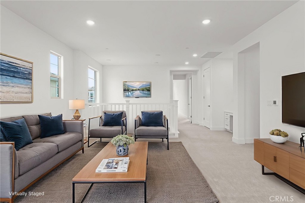 5208 Solace Drive Rancho Mission Viejo, CA 92694 - Photo 25 of 27 a living room with furniture and a flat screen tv