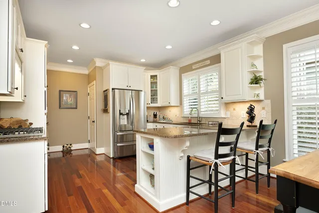 a view of a dining room with furniture and window