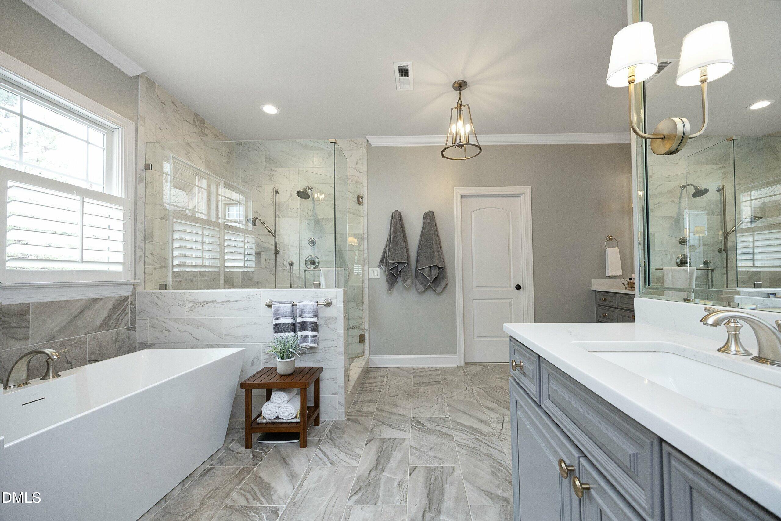 2705 Peachleaf Street Raleigh, NC 27614 - Photo 3 of 52 a spacious bathroom with a tub sink shower and mirror