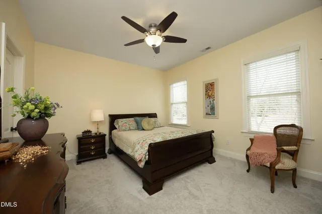 a view of a yard with wooden fence