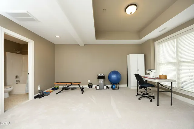 a front view of a house with a yard table and chairs