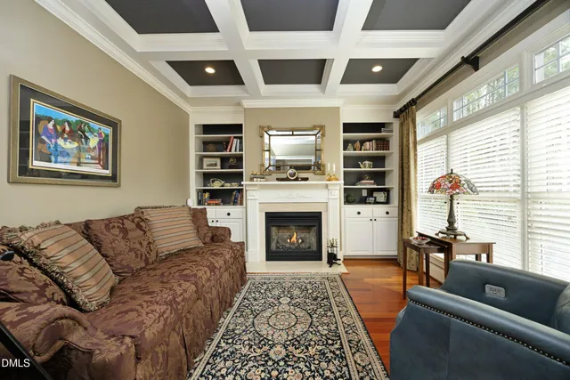 a bedroom with furniture and a large window