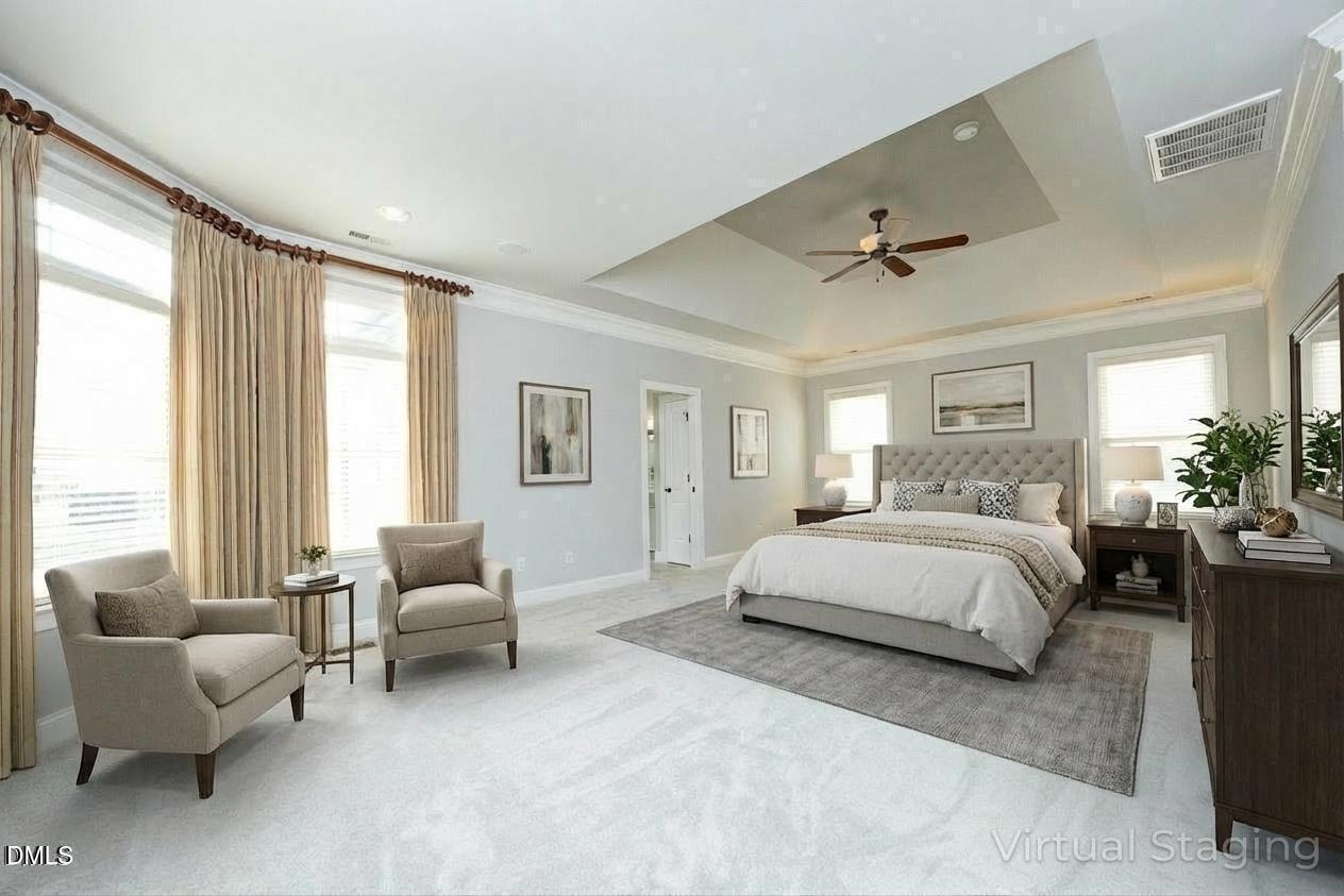 2705 Peachleaf Street Raleigh, NC 27614 - Photo 6 of 52 a spacious bedroom with a bed a couch and a large window