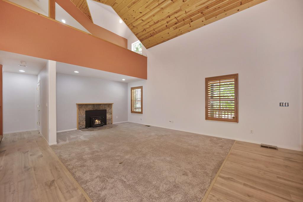 1861 Rubicon Road Georgetown, CA 95634 - Photo 13 of 68 a view of an empty room with a fireplace and a window