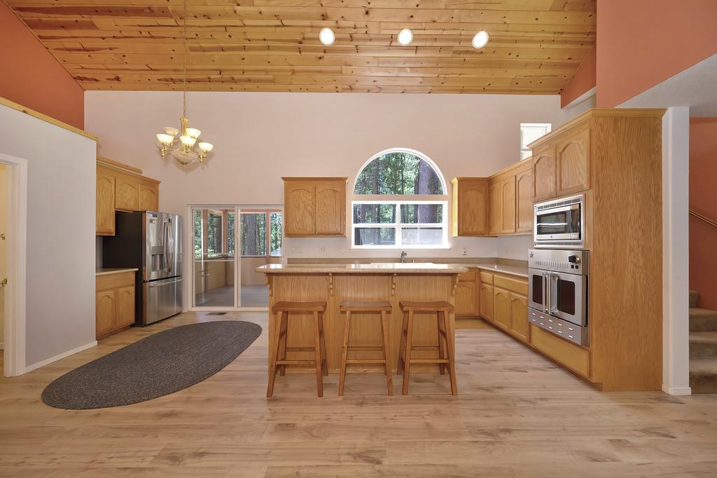 1861 Rubicon Road Georgetown, CA 95634 - Photo 17 of 68 a kitchen with stainless steel appliances granite countertop a stove a sink and a refrigerator