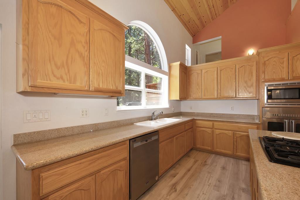 1861 Rubicon Road Georgetown, CA 95634 - Photo 20 of 68 a kitchen with stainless steel appliances granite countertop a sink stove and cabinets