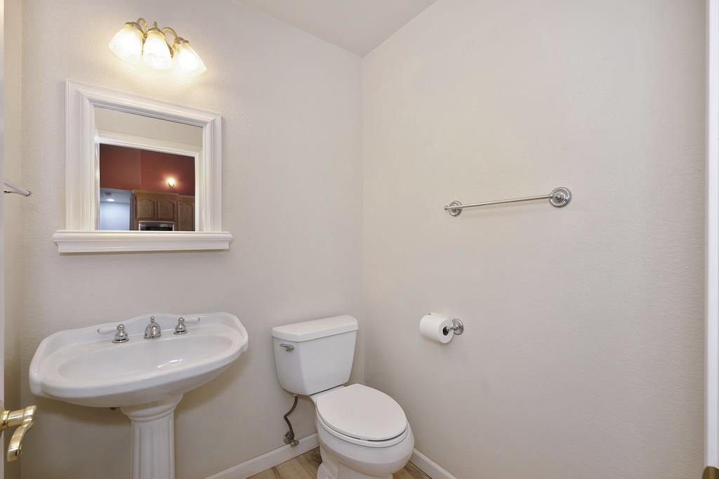 1861 Rubicon Road Georgetown, CA 95634 - Photo 26 of 68 a bathroom with a sink mirror and toilet