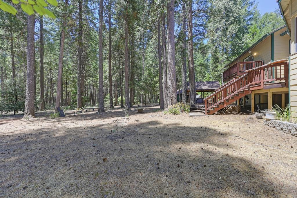 1861 Rubicon Road Georgetown, CA 95634 - Photo 56 of 68 a view of a house with large trees and wooden fence