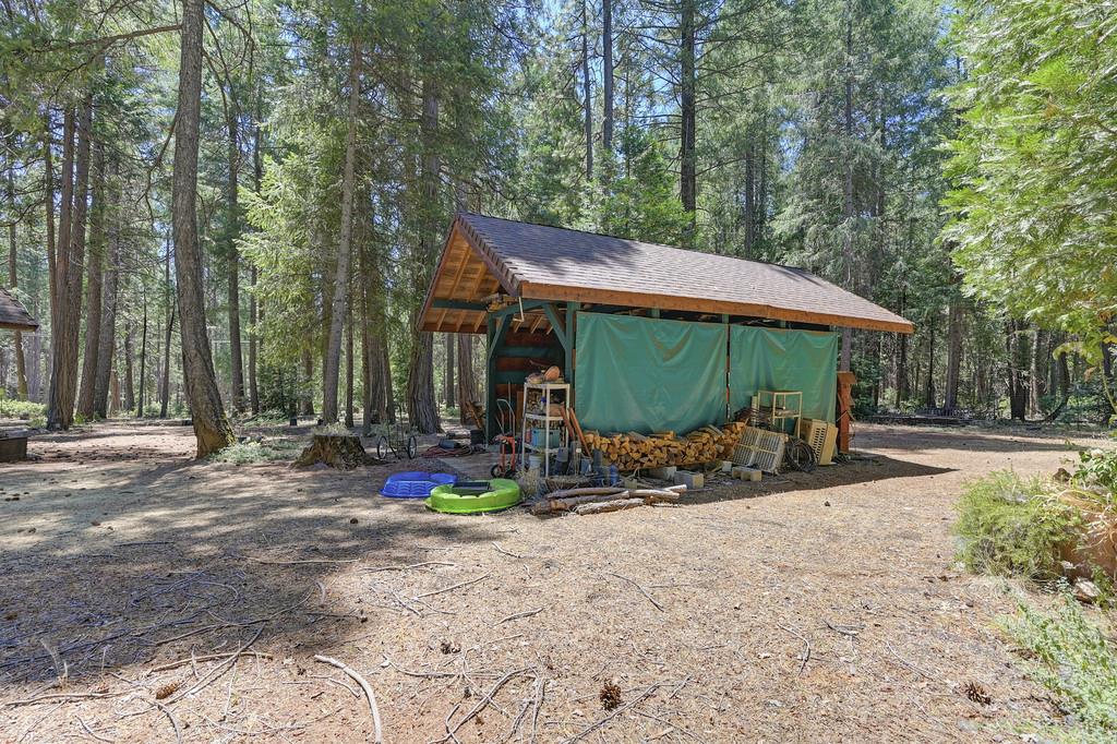1861 Rubicon Road Georgetown, CA 95634 - Photo 65 of 68 a view of patio with a table and chairs under an umbrella