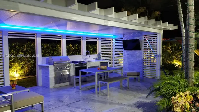 a view of a chairs and table in a patio