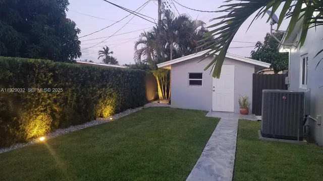a view of a back yard of the house