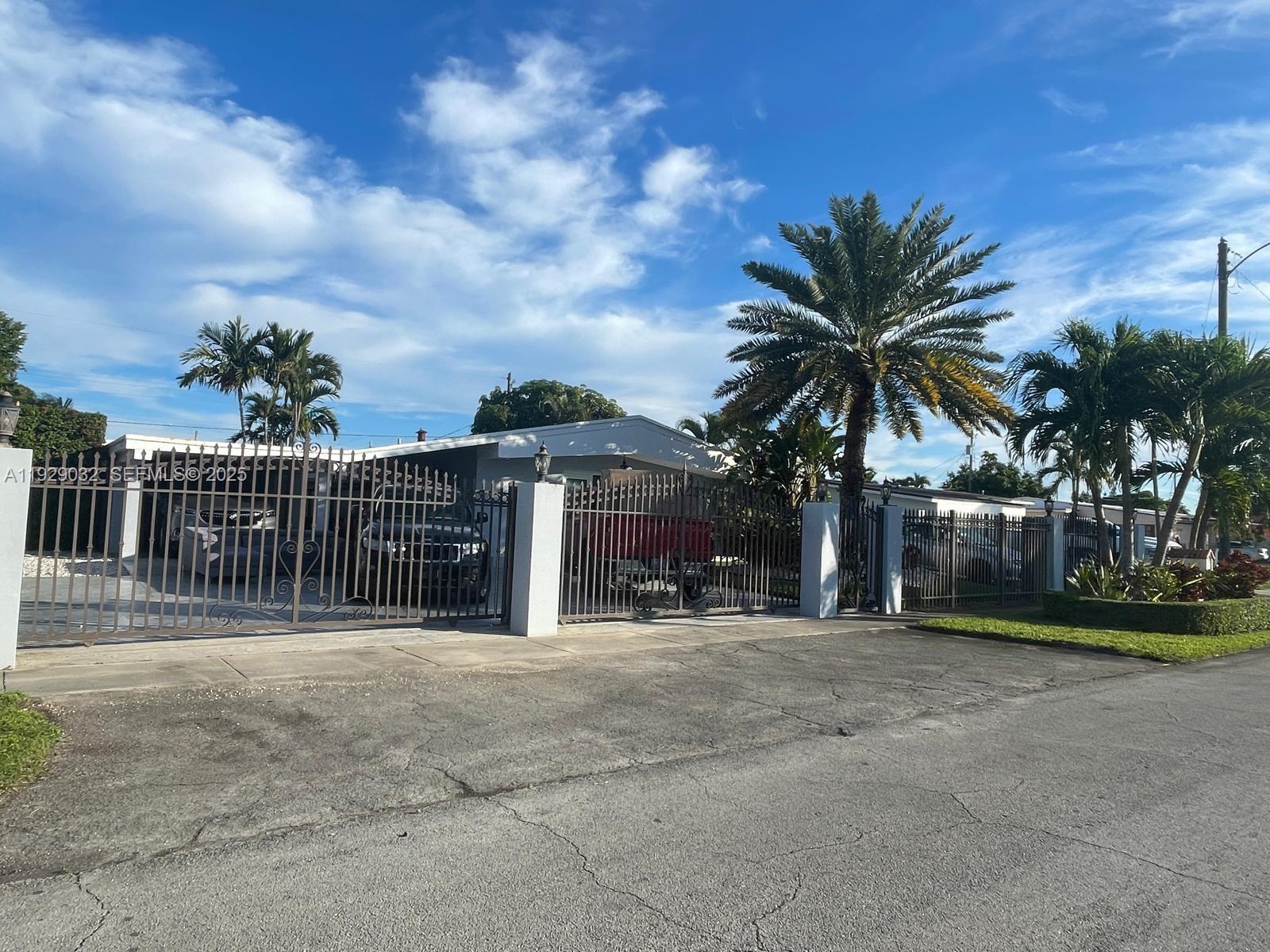 1071 West 66th Street Hialeah, FL 33012 - Photo 2 of 17 a view of a house with a outdoor space
