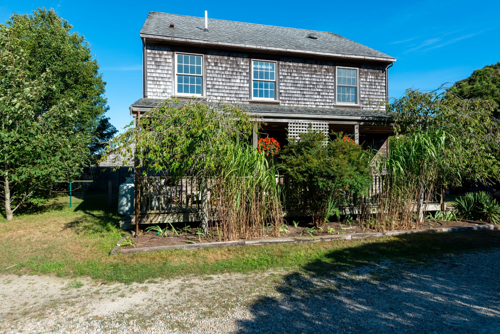 12 Appleton Road Nantucket, MA 02554 - Photo 1 of 24 a front view of a house with garden