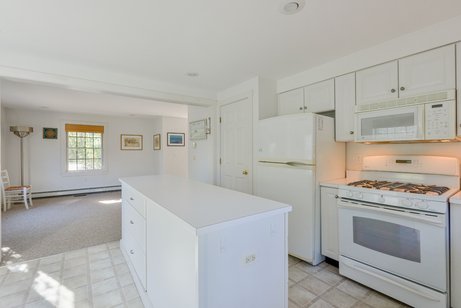 12 Appleton Road Nantucket, MA 02554 - Photo 12 of 24 a kitchen with white cabinets and white appliances