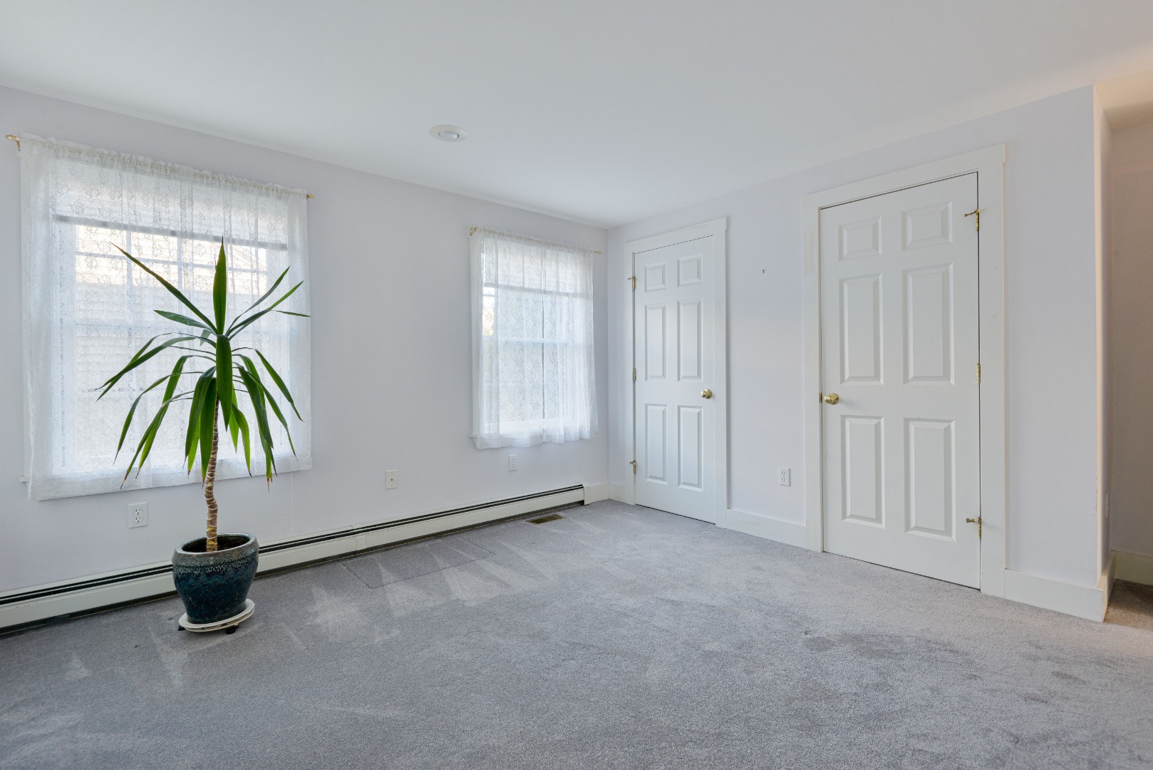 12 Appleton Road Nantucket, MA 02554 - Photo 14 of 24 an empty room with windows and natural light