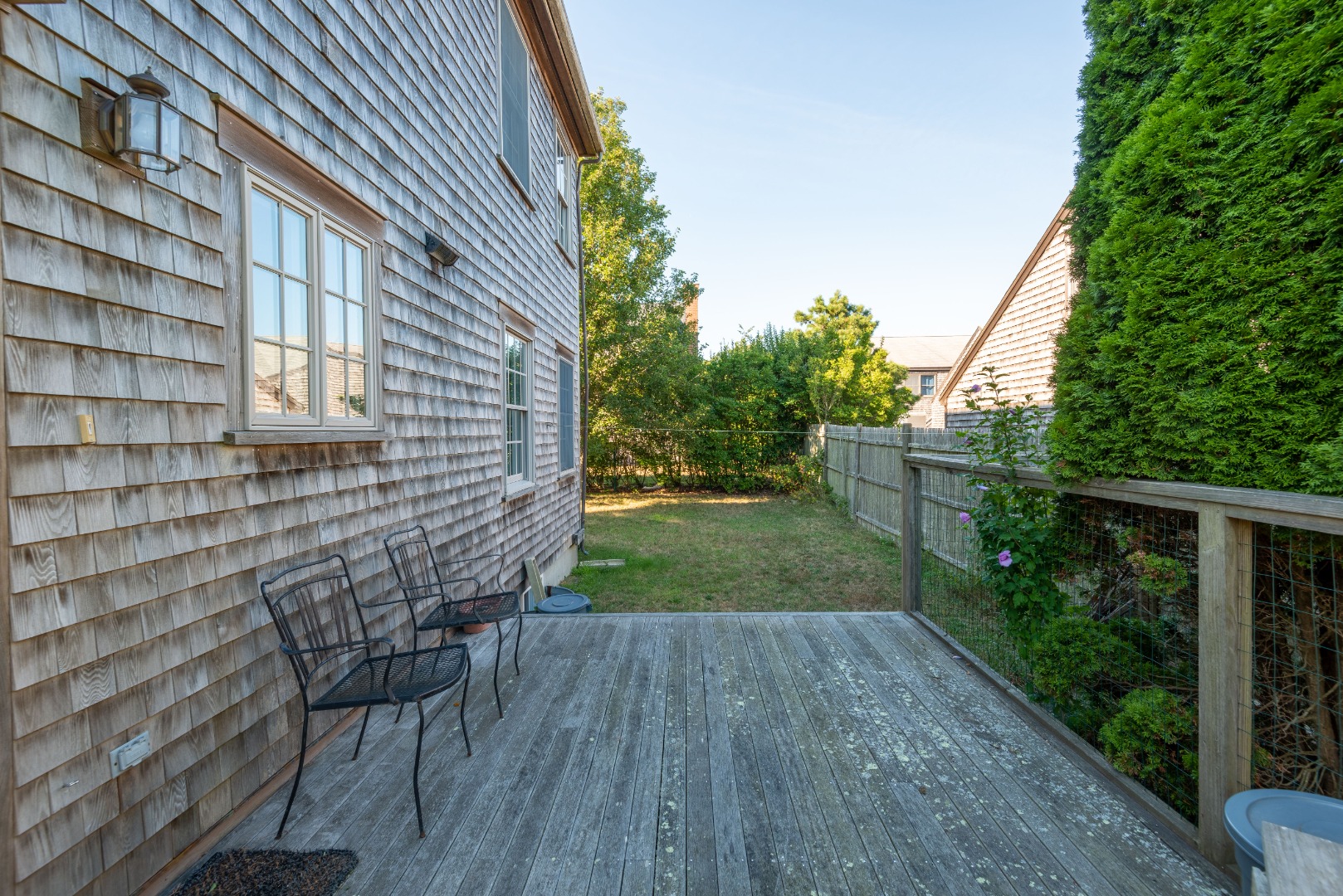 12 Appleton Road Nantucket, MA 02554 - Photo 5 of 24 a backyard of a house with lots of green space