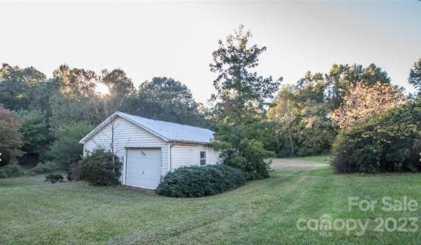610 Jackson Road Salisbury, NC 28146 - Photo 1 of 6 a view of a small house in middle of the green field