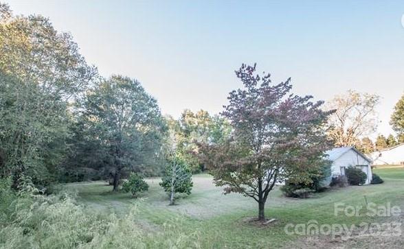 610 Jackson Road Salisbury, NC 28146 - Photo 3 of 6 a big yard with lots of green space and plants