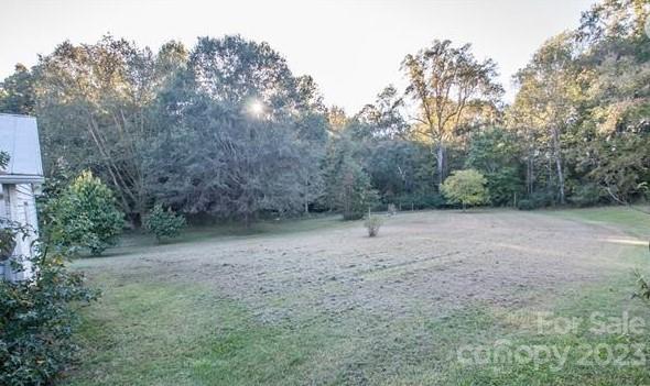 610 Jackson Road Salisbury, NC 28146 - Photo 5 of 6 a view of a forest with trees in the background
