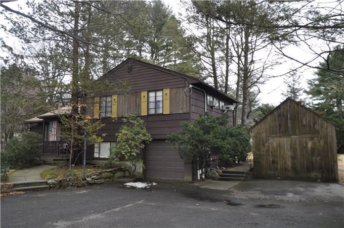 223 Stillson Road Fairfield, CT 06825 - Photo 1 of 1 a front view of a house with a yard