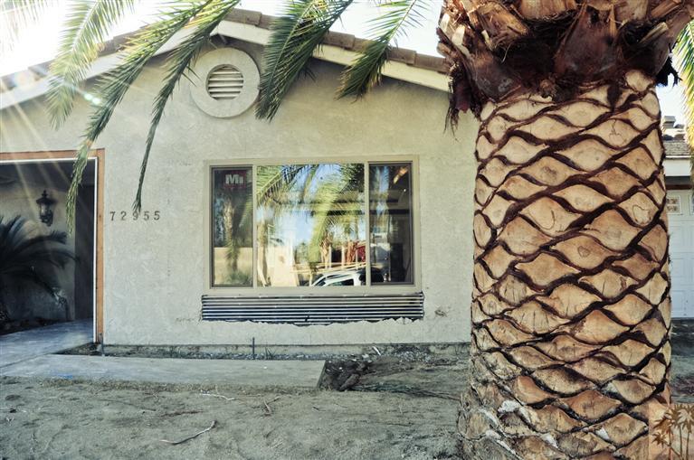 72955 Somera Road Palm Desert, CA 92260 - Photo 8 of 16 a view of a house with a door and a window