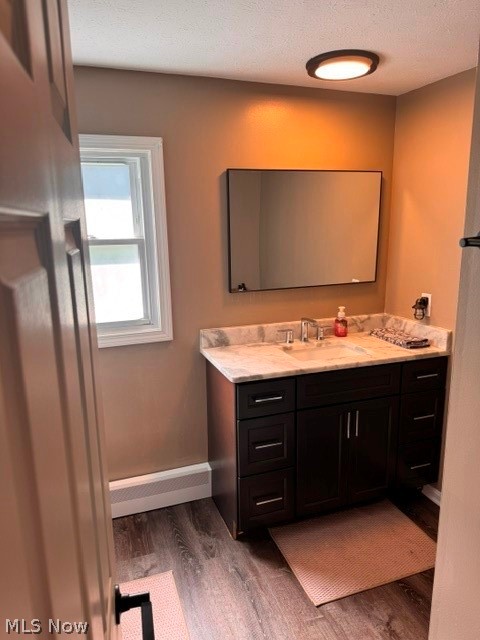 2760 Haines Road Madison, OH 44057 - Photo 30 of 33 Bathroom featuring a dark wood-finish vanity with a marbled countertop, integrated sink, and an expansive rectangular mirror