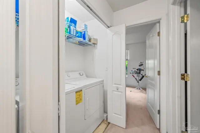 a view of a livingroom with a ceiling fan and window