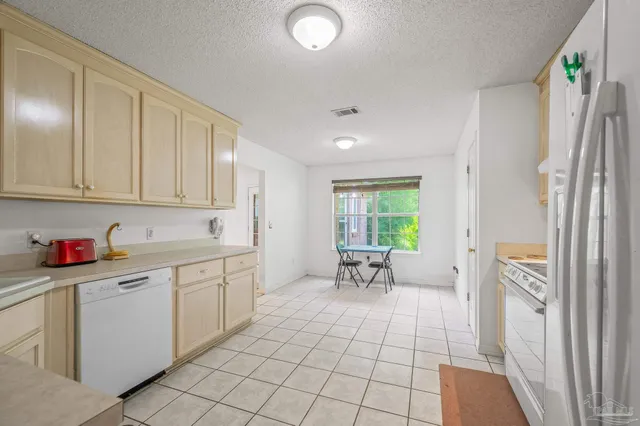 a view of a livingroom with furniture and a window