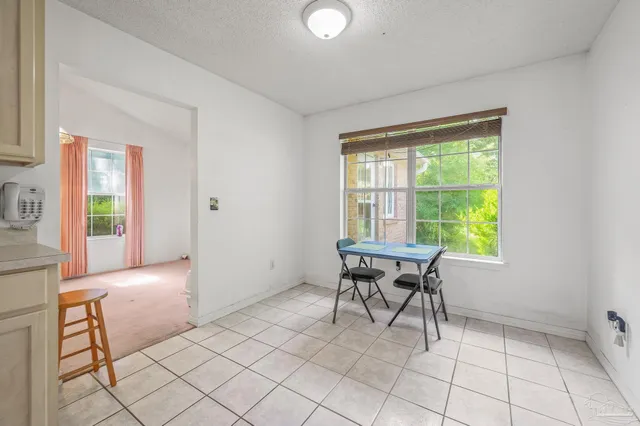 a spacious bathroom with a sink toilet a mirror and vanity