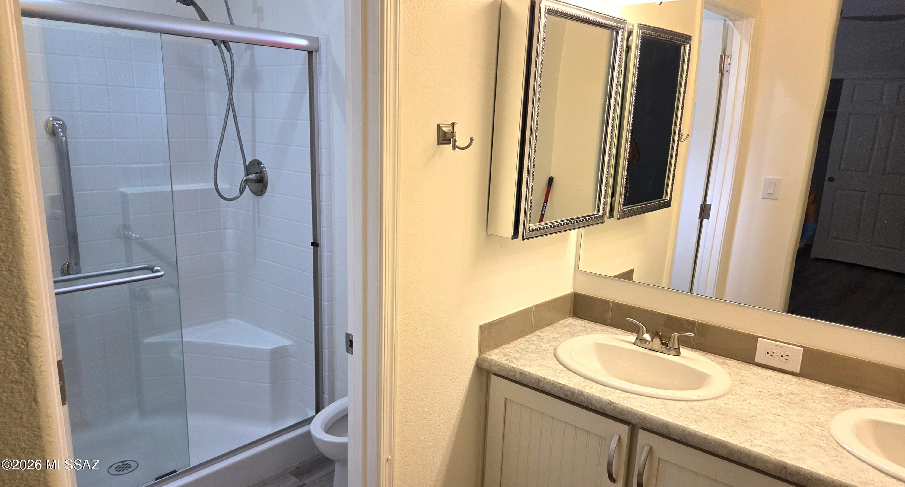 1030 Barrel Cactus Ridge, Unit 118 Benson, AZ 85602 - Photo 17 of 22 a bathroom with a sink and mirror