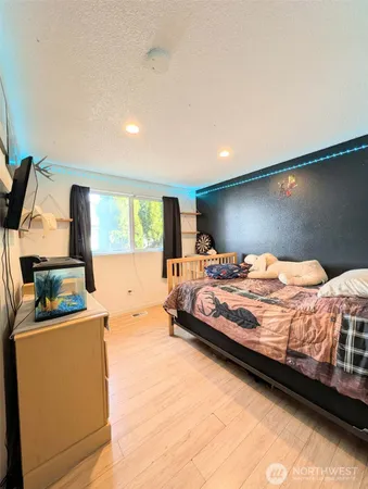 a bedroom with a bed and window
