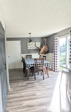 a view of a dining room with furniture window and outside view