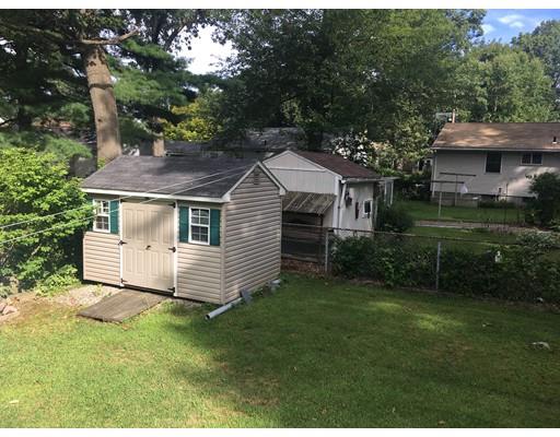 44 Colorado Street Springfield, MA 01118 - Photo 5 of 12 a front view of a house with a garden