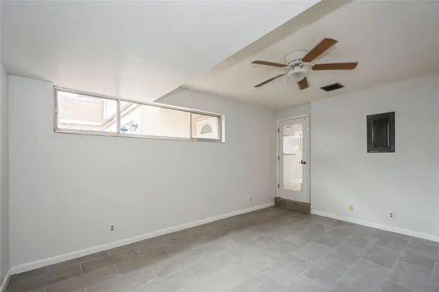 a view of room with window and ceiling fan