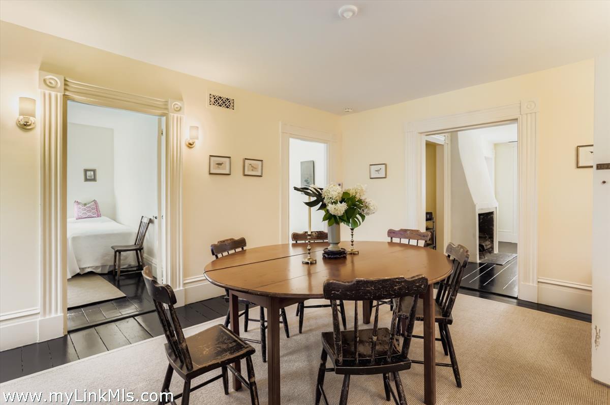 27 Spring Street Vineyard Haven, MA 02568 - Photo 33 of 58 a view of a dining room with furniture and a potted plant
