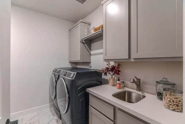 a kitchen with a sink and cabinets