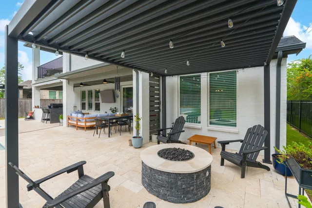 a patio with a table and chairs