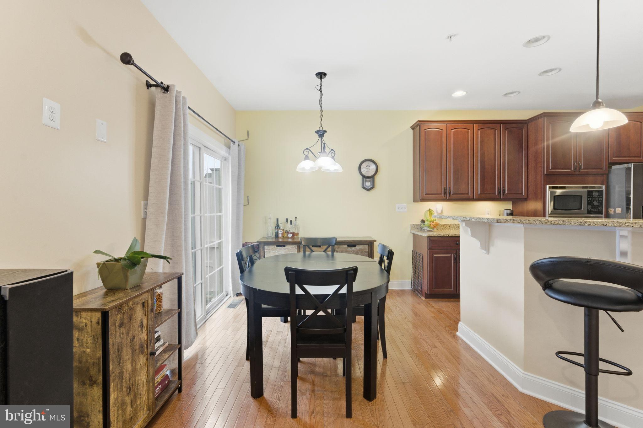 7611 Elmcrest Road Hanover, MD 21076 - Photo 14 of 64 Charming dining area with modern kitchen.