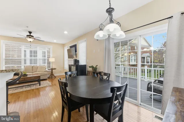 a kitchen with granite countertop wooden cabinets stainless steel appliances and a counter space