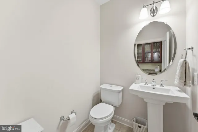 a spacious bathroom with a tub sink shower and mirror
