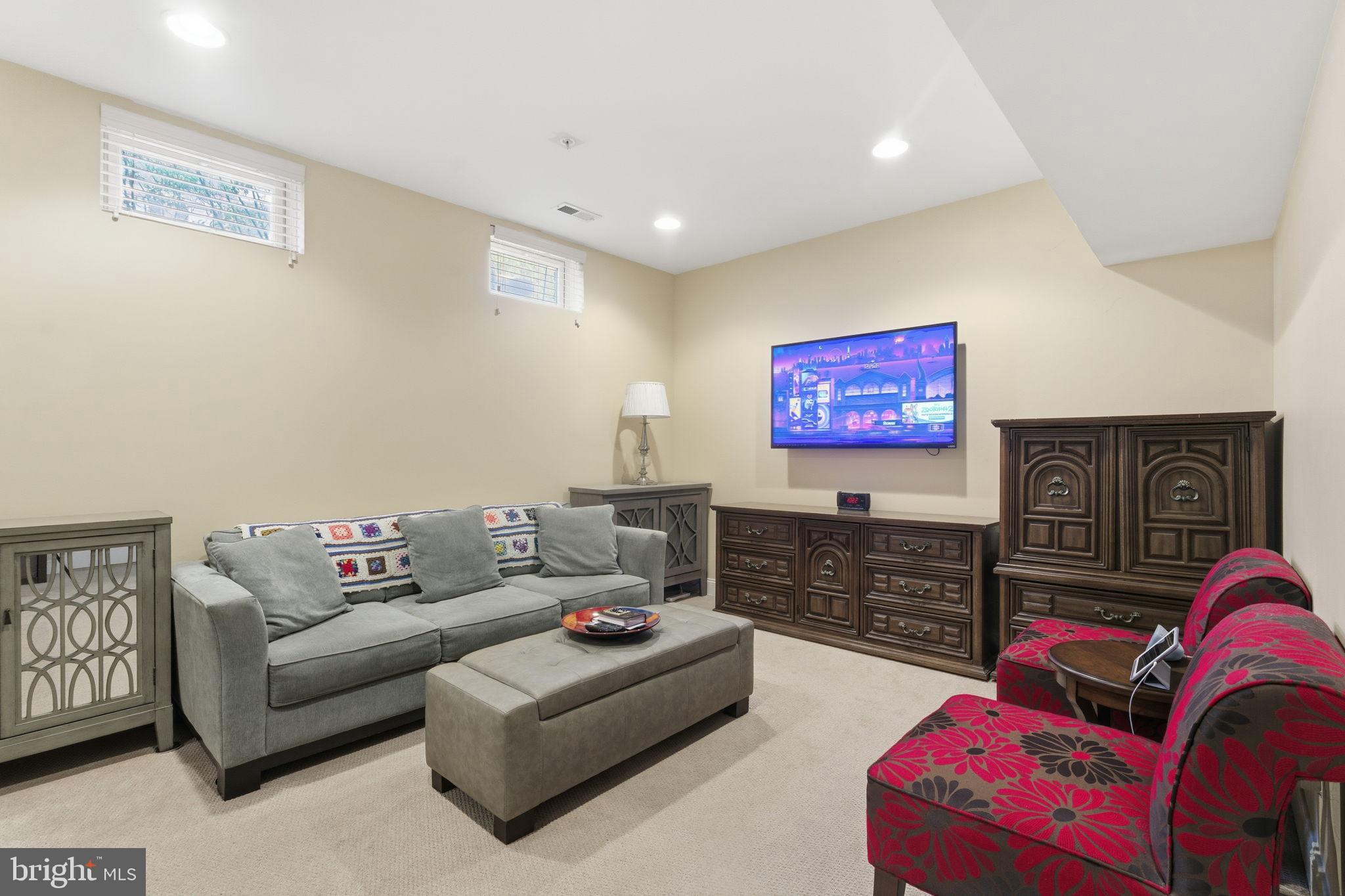 7611 Elmcrest Road Hanover, MD 21076 - Photo 52 of 64 Cozy basement retreat with modern flair.