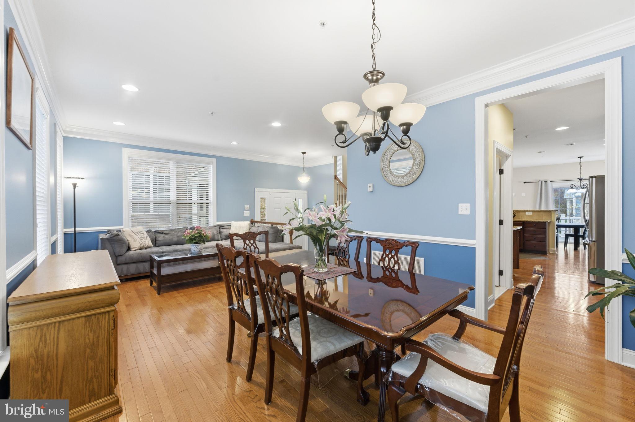 7611 Elmcrest Road Hanover, MD 21076 - Photo 6 of 64 Elegant dining space with serene blue walls.